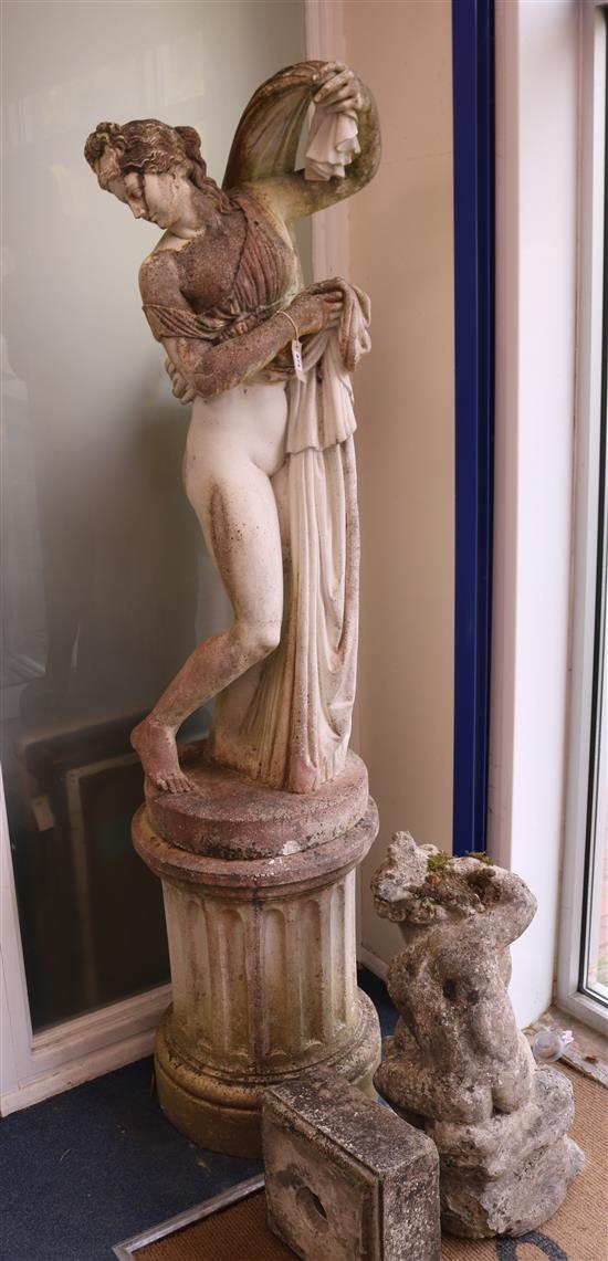 A reconstituted stone statue of Venus on a plinth column base W.50cm approx.